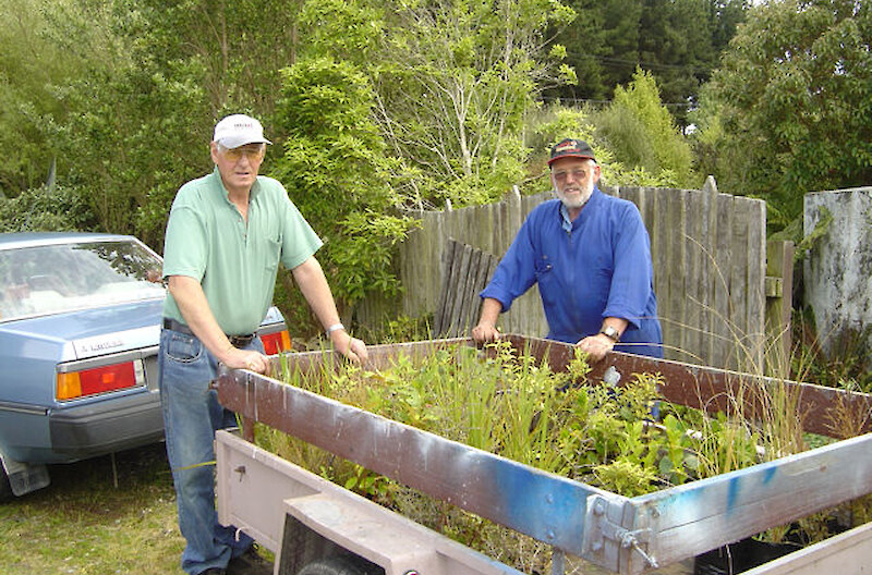 Allan and John with plants propagated by them at the Southland Community Nursery, Otatara, for a Lions Club planting working bee at Kew Bush.