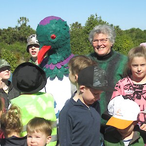 2019 Bushy Point triple celebration. The new OLG mascot, the kereru 'Russell', with May Evans and admiring fans.