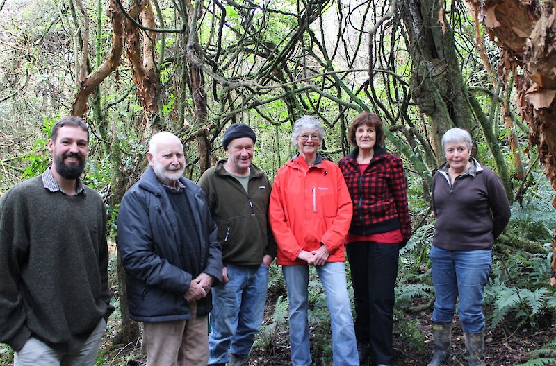 Sam Gibson (at the very left) from Goodnature explaining about the Goodnature traps the Trust wants to use to eradicate pests in the forest. Trust members - from left to right - are Malcolm Mackenzie, Ken White, Agnes Irwin, Glenys Dickson, Jan Riddell.